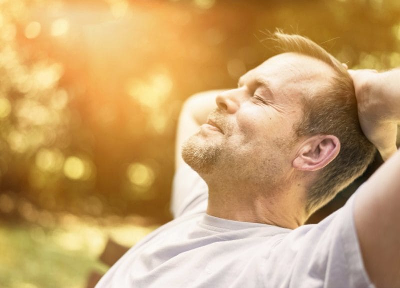 man sunbathing - skin cancer screening London - Echelon Health